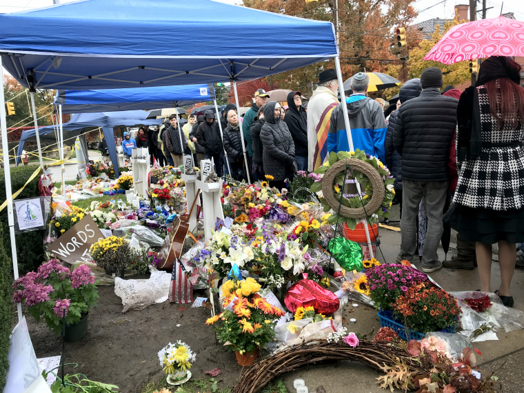 Flowers and memorials lay outside the Tree of Life Synagogue during the the vigil outside the building where 11 people lost their lives last week in Pittsburgh, Pennsylvania, on Nov. 3, 2018.