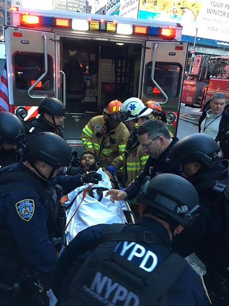 Image: Emergency service workers load Akayed Ullah, a 27-year-old Bangladeshi man suspecting of setting off a bomb at New York City's Port Authority Bus Terminal, into an ambulance on Dec. 11, 2017.