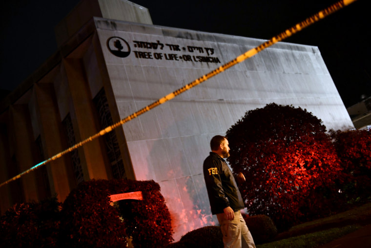 An FBI agent outside of the Tree of Life Synagogue, where 11 people were killed by a gunman, in Pittsburgh on Oct. 27, 2018.