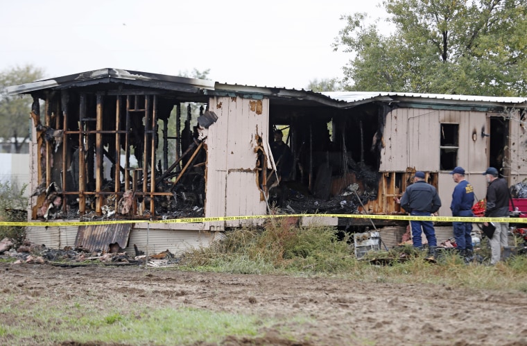 Fire marshals investigate the cause of a deadly house fire near Wolfforth, Texas, on Nov. 8, 2018.