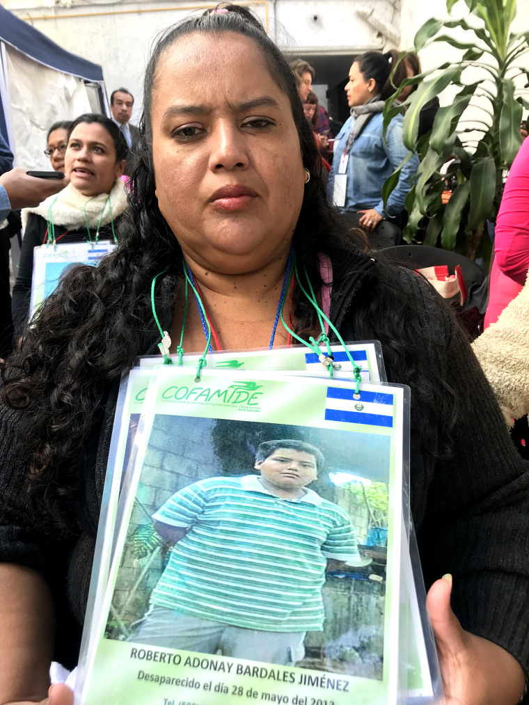 Rosa Jimenez holds the last photo she took of her son Roberto before he left home in El Salvador for the United States. 