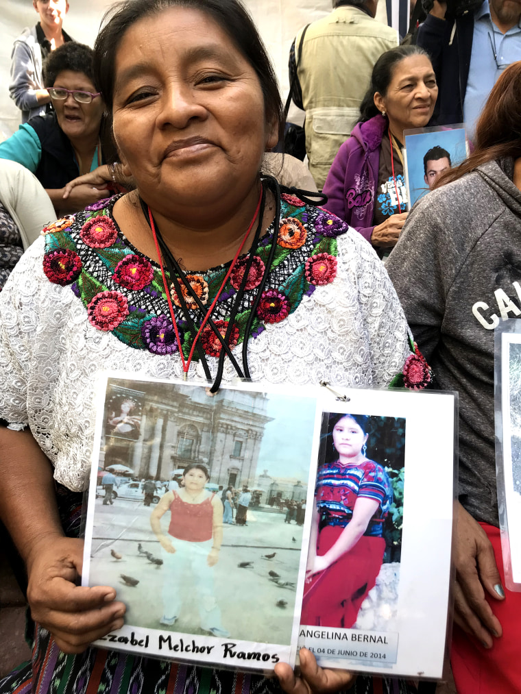 Marcela Melchor, from Guatemala, holds a photo of her sister, Isabel Melchor Ramos