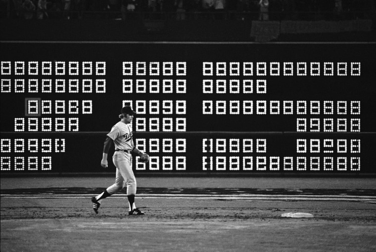 The scoreboard flashes "715" seconds after Hank Aaron hit his recording breaking 715th home run in 1974.