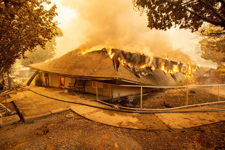 The Feather River Hospital is engulfed in flames as the Camp Fire rages through Paradise, California, on Nov. 8, 2018.