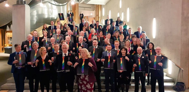 Members of Scottish Parliament pose with the symbol of the TIE campaign after announcing their LGBTI curriculum on Nov. 8, 2018.