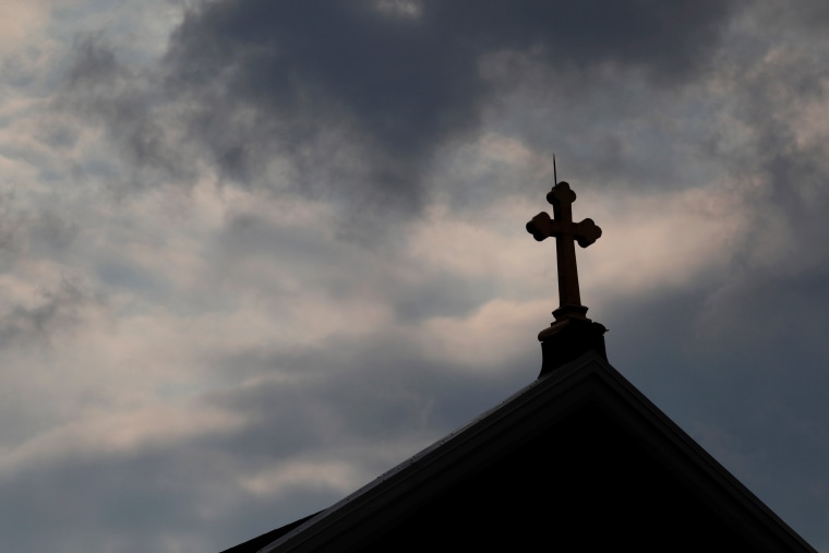 Image: Storm clouds pass over a Roman Catholic church in Pittsburgh