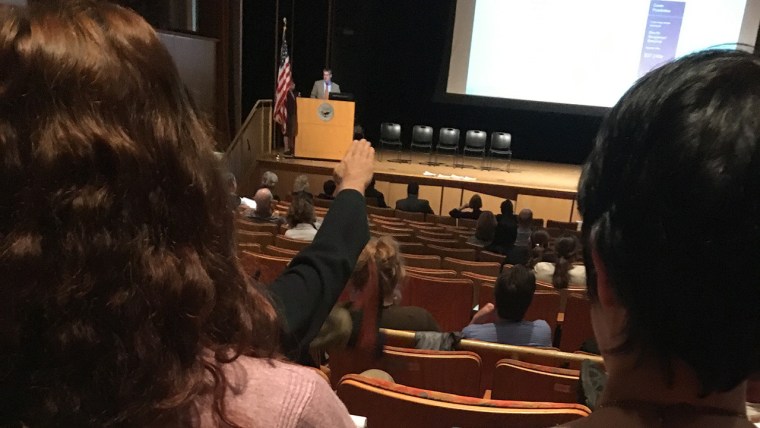 Charles Meyrick, a professor at Housatonic Community College, raises his hand in an apparent Nazi salute