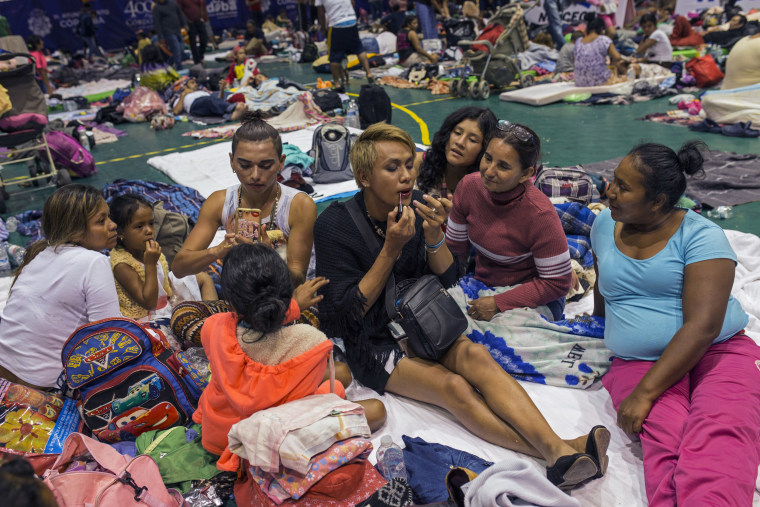 Two transgender women traveling with the migrant caravan apply makeup at a shelter in Cordoba, Mexico on Nov. 4, 2018.