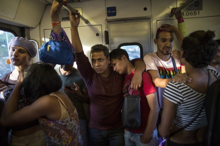 A group of transgender women and gay men ride a subway into Mexico City while traveling with the migrant caravan on Nov. 8, 2018.