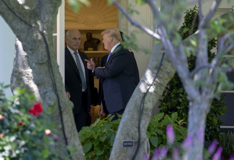 John Kelly speaks to President Donald Trump as he departs the Oval Office on July 18, 2018.