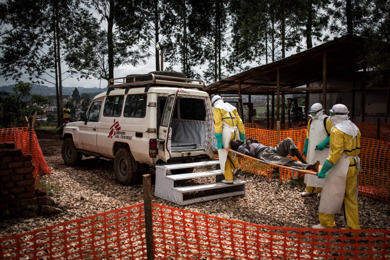 Health workers move a patient to a hospital after he was cleared of being infected with Ebola in the Democratic Republic of Congo on Nov. 4, 2018.