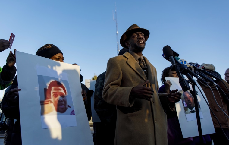 Eric Russell speaks as protesters rally outside the Midlothian Police Department in Midlothian, Illinois on Nov. 13, 2018.