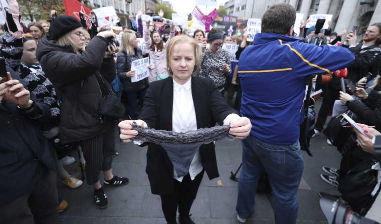 Image: Irish lawmaker Ruth Coppinger holds a thong during a protest 