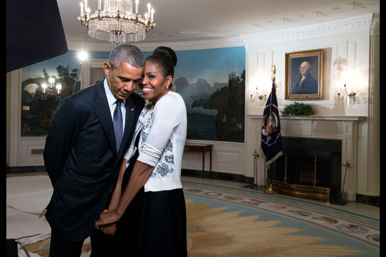 Image: First Lady Michelle Obama snuggles against President Barack Obama before a videotaping for the 2015 World Expo, in the Diplomatic Reception Room of the White House, March 27, 2015.