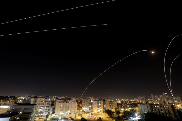 Image: A general view of the Israeli city of Ashkelon, as an Iron Dome anti-missile fires near the Israeli side of the Israel-Gaza border