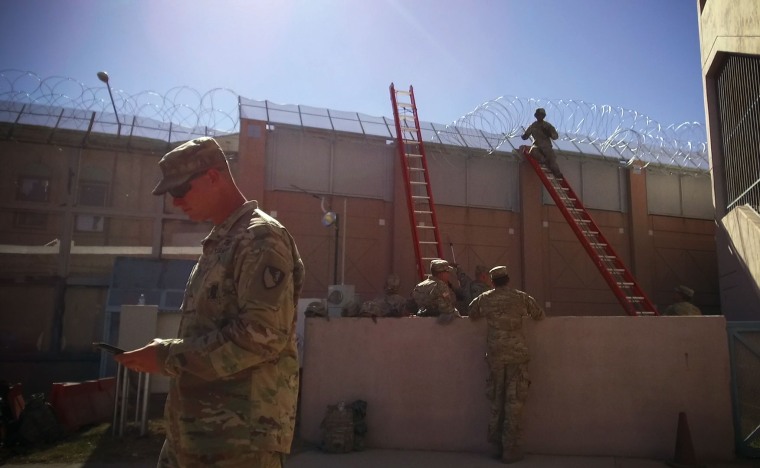Troops use concertina wire to reinforce the Deconcini Crossing in Nogales, Arizona.