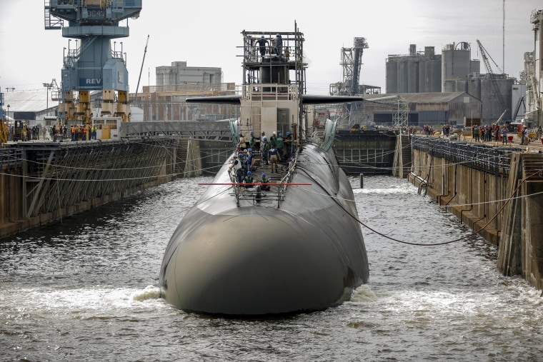 Image: A submarine in one of the Norfolk Naval Shipyard's dry docks, which can be pumped dry to allow repairs on a vessel.