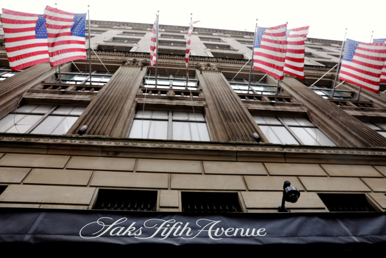 Image: U.S. flags fly outside of Saks Fifth Avenue in New York