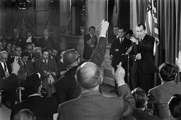 President Richard Nixon picks a questioner as newsmen vie for his attention during a televised news conference in the White House East Room March 14, 1969 in Washington.