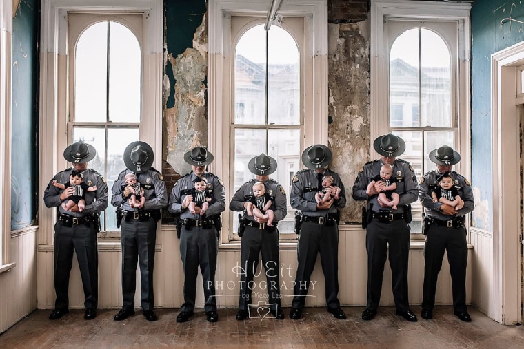 Seven Kentucky State Police officers pose with their babies.