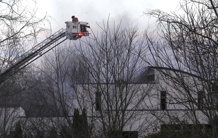 Authorities say two adults and two children were found dead at the scene of a burning mansion near the New Jersey shore.