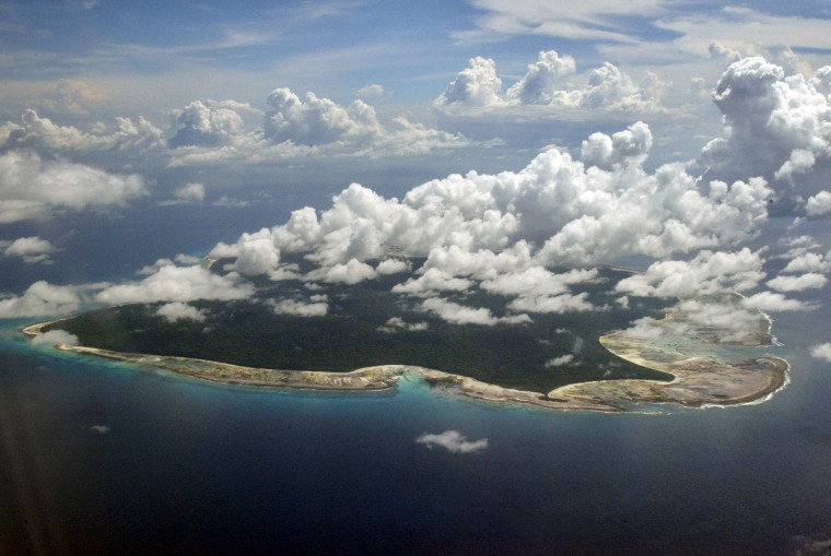 Image: Clouds hang over the North Sentinel Island, in India's southeastern Andaman and Nicobar Islands.