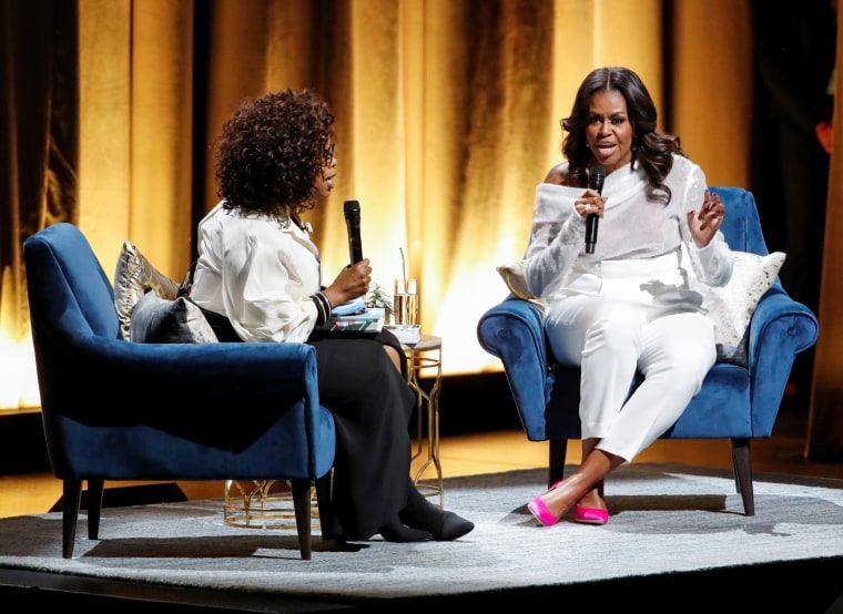 Image: Oprah Winfrey talks with former first lady Michelle Obama in Chicago