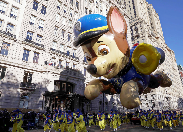 Image: A float hovers above the crowd during the Macy's Thanksgiving Day Parade in Manhattan