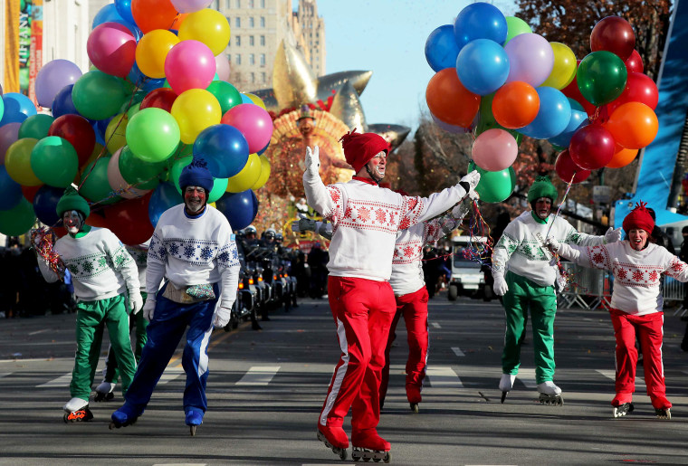 Image: Clowns on roller blades perform during the Macy's Thanksgiving Day Parade in Manhattan