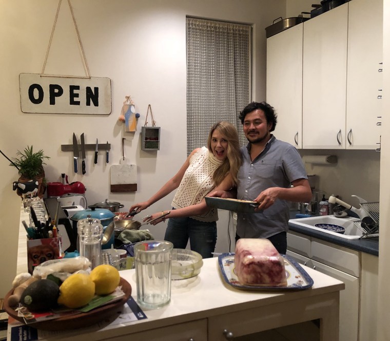 Emily and Alex cookign in the kitchen