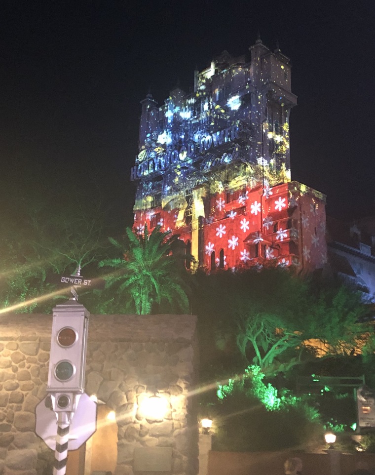 In the Sunset Seasons Greetings projection show at Disney's Hollywood Studios, the Hollywood Tower Hotel is transformed into a magical Christmas display.