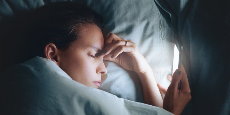Close-Up Of Woman Sleeping On Bed At Home