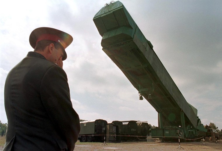 Image: A SS-24 nuclear missile booster is extracted from its bunker in Ukraine in 1998