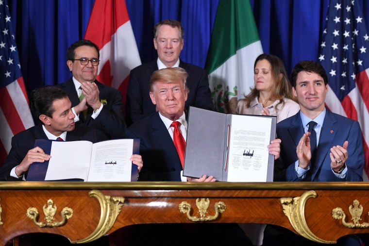 Mexico President Enrique Pena Nieto, left, President Donald Trump and Canadian Prime Minister Justin Trudeau sign a new free trade agreement at the G20 Leaders' Summit in Buenos Aires on Nov. 30, 2018.
