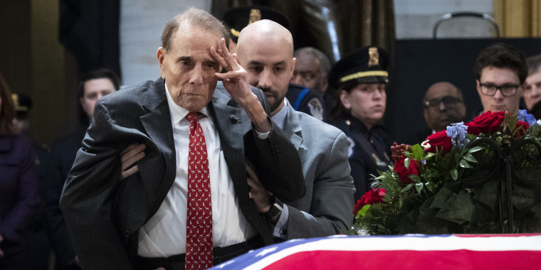 Bob Dole salutes casket of late President George H.W. Bush