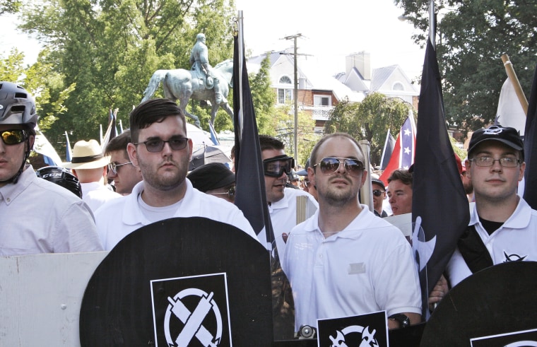 Image: James Alex Fields Jr., second from left, holds a black shield during a white supremacist rally in Charlottesville