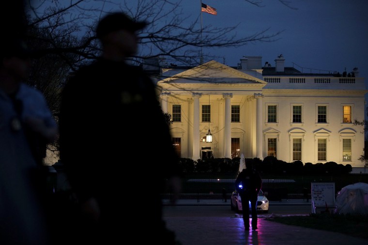 The Secret Service stand guard outside the White House on March 6, 2017.