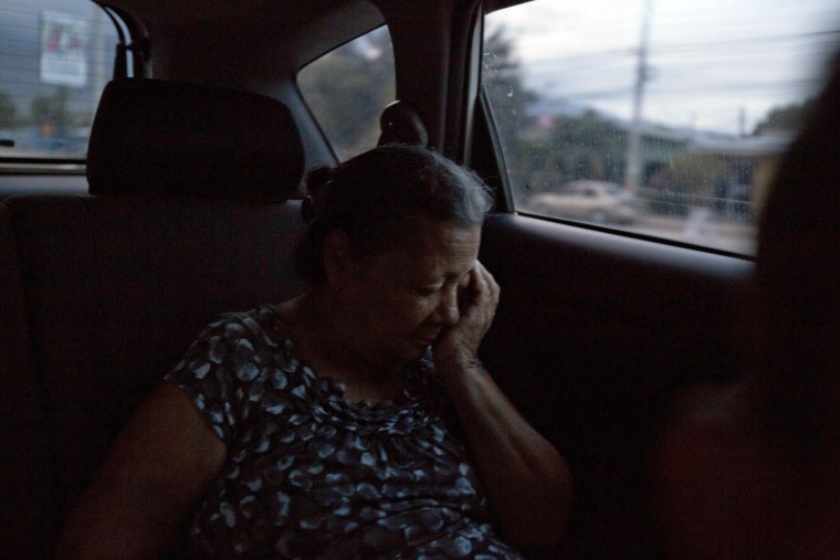 Image: Haydee Posadas rides home after an interview in San Pedro Sula, Honduras, on Oct. 30, 2018.