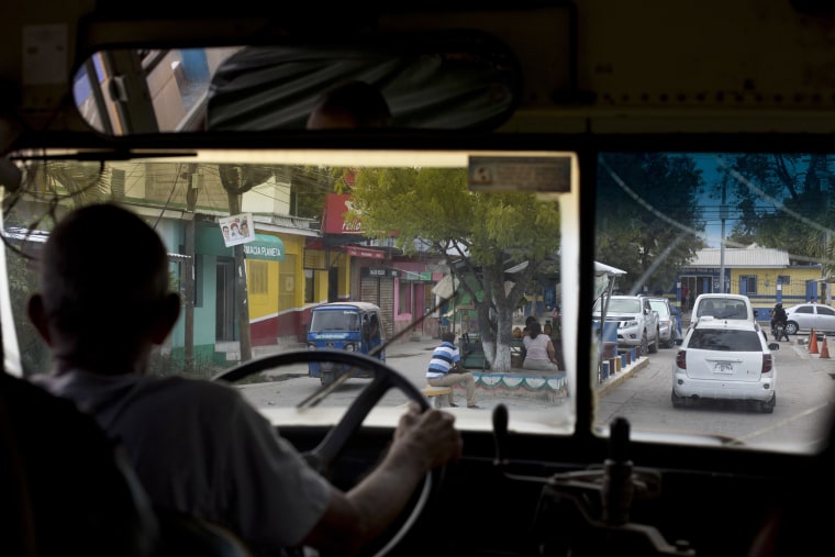 Image: A bus transporting relatives for Nunez's burial drives through San Pedro Sula, Honduras, on Oct. 31, 2018.