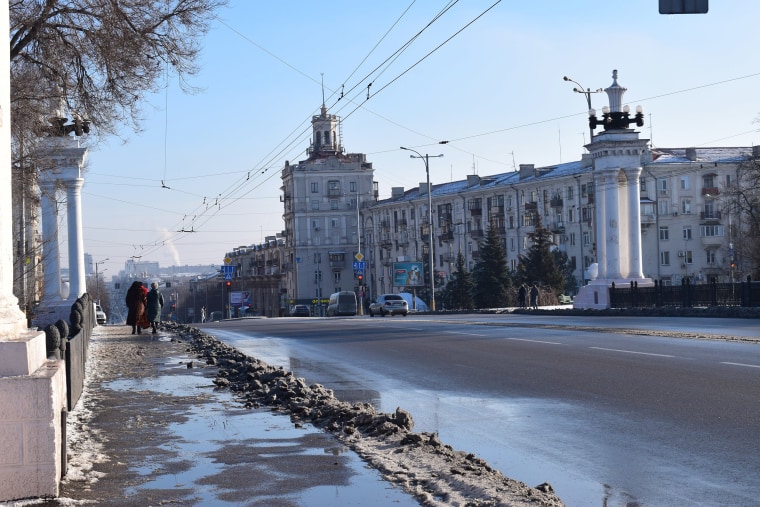 Image: Residents walk along Prospect Soborniy, Zaporizhzhia's main street, the Sunday after martial law was introduced.