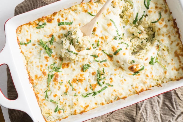 This spinach and artichoke quinoa bake is easy to transport to any party and pop in the oven to reheat.