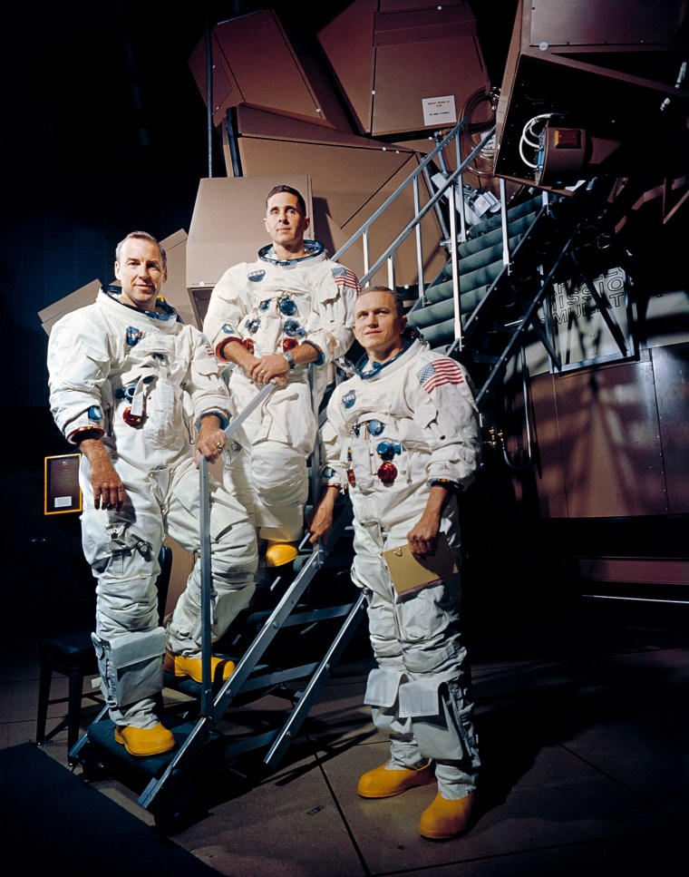 From left, Apollo 8 crew members James Lovell Jr., William Anders and Frank Borman beside the Apollo Mission Simulator at the Kennedy Space Center.