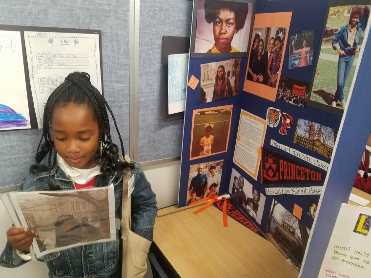 Ella-Lorraine Brown, 8, dressed as Michelle Obama, with her Cultural Heroes Day project on the former First Lady as an undergrad and young lawyer.