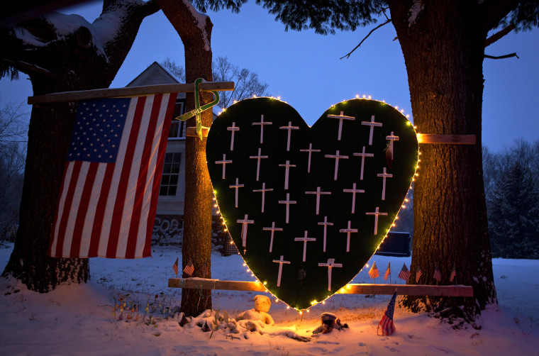 Image: A heart bearing 26 crosses, one for each victim of the Sandy Hook massacre