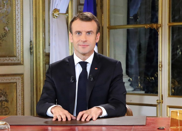 Image: French President Emmanuel Macron poses before a special address to the nation