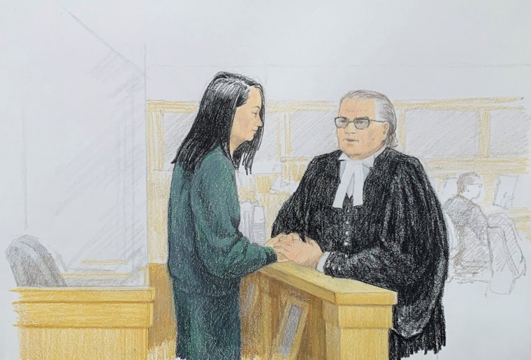 Image: Meng Wanzhou, Huawei's chief financial officer, speaks with lawyer David Martin in court in Vancouver, British Columbia, on Dec. 10, 2018.
