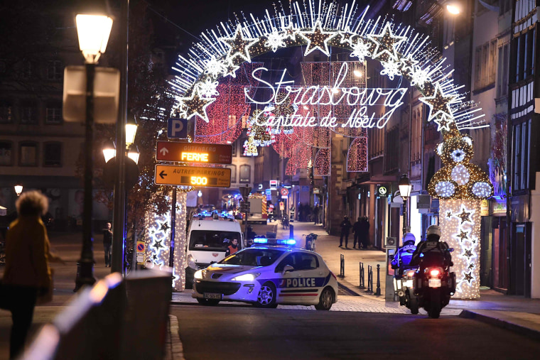 Image: A police car drives in the streets of Strasbourg, eastern France, after a shooting