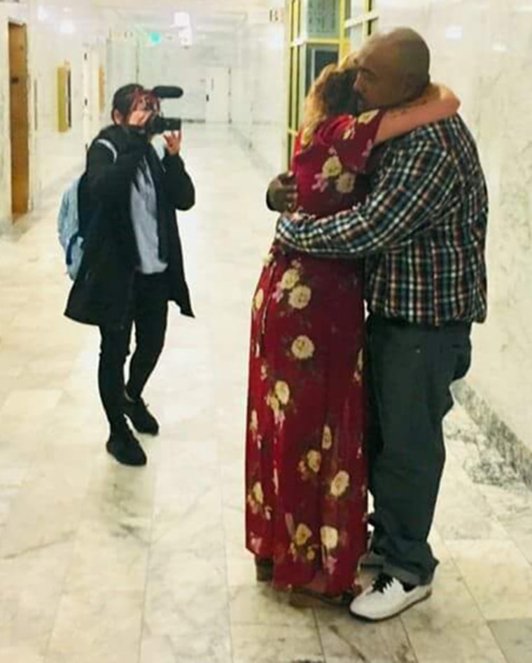 Sophy Hem hugs his wife Shelly Bingham after his pardon hearing on June 8, 2018