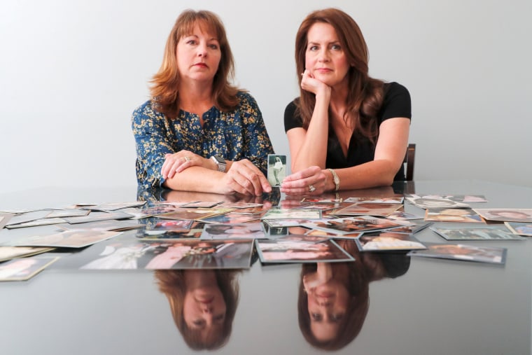 Image: Cady Evans and her sister Crystal Deckard hold an old photograph as they reminisce on the loss of their mother in California