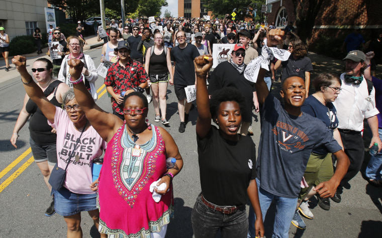 Image: Demonstrators against racism march along city streets as they mark the anniversary of last year's Unite the Right rally in Charlottesville